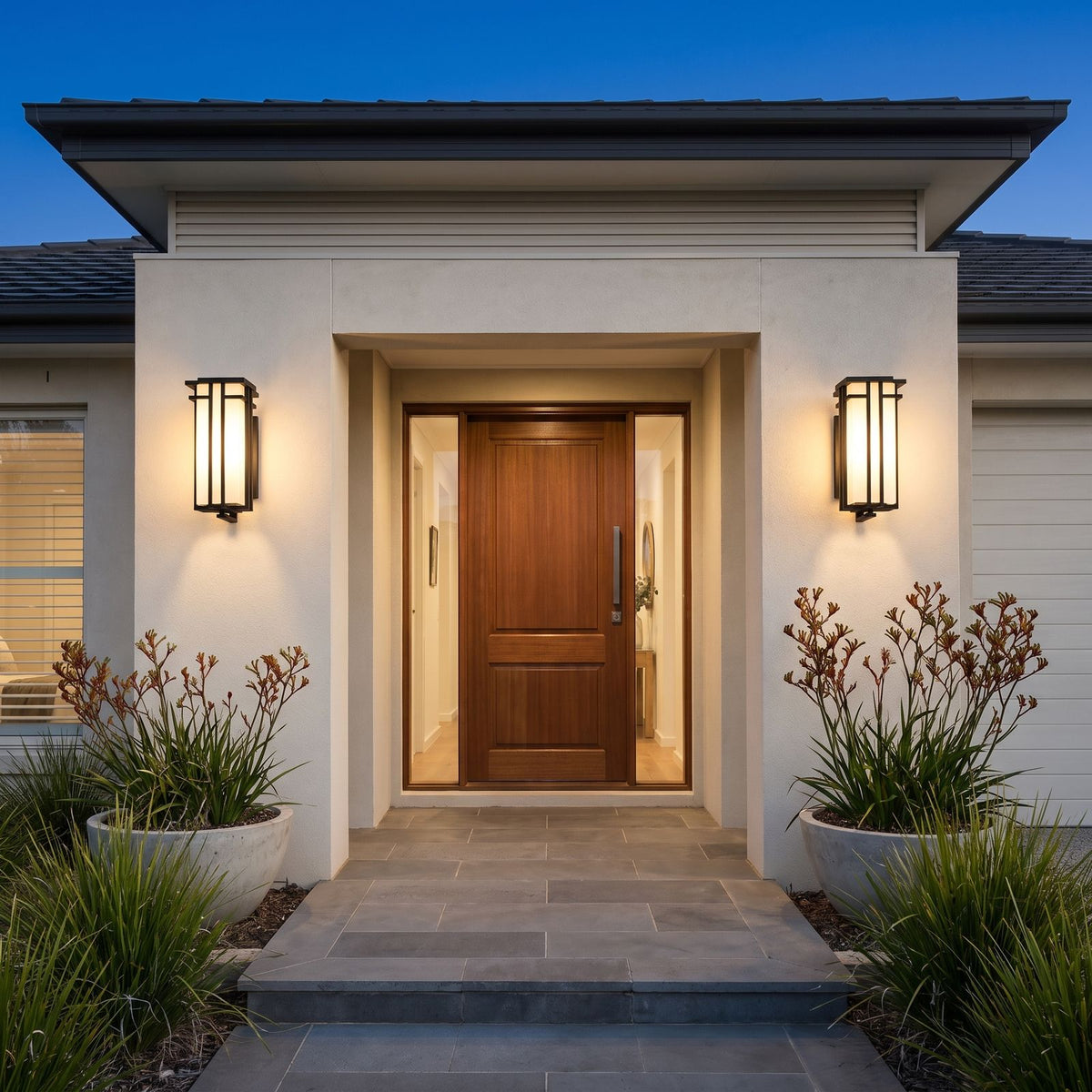 A pair of Frosted Glass Prairie Outdoor Wall Lanterns either side of an entry