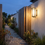Frosted Glass Prairie Outdoor Wall Lantern on a garden path wall at dusk