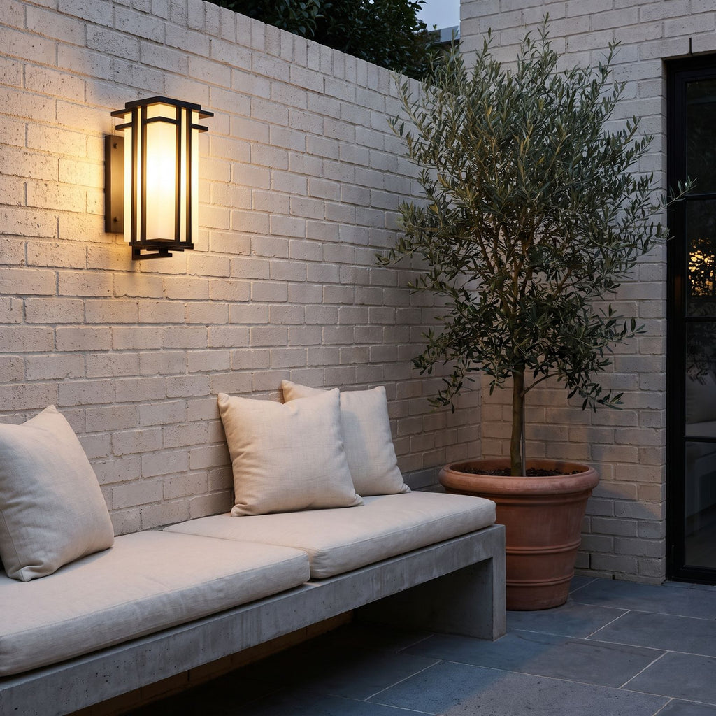 Frosted Glass Prairie Outdoor Wall Lantern above a courtyard bench