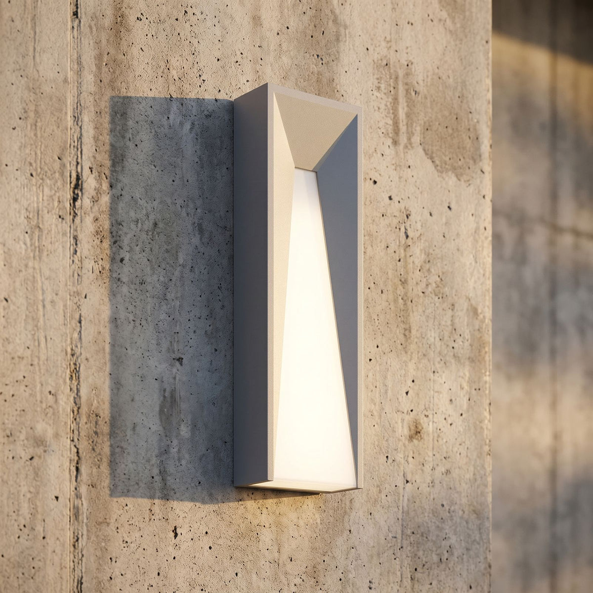 Geometric Layered Metal Outdoor Wall Light, close view at 45 degrees on a stone wall