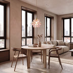 Glass Blossom Cluster Pendant Light in pink glass above a round table in an apartment