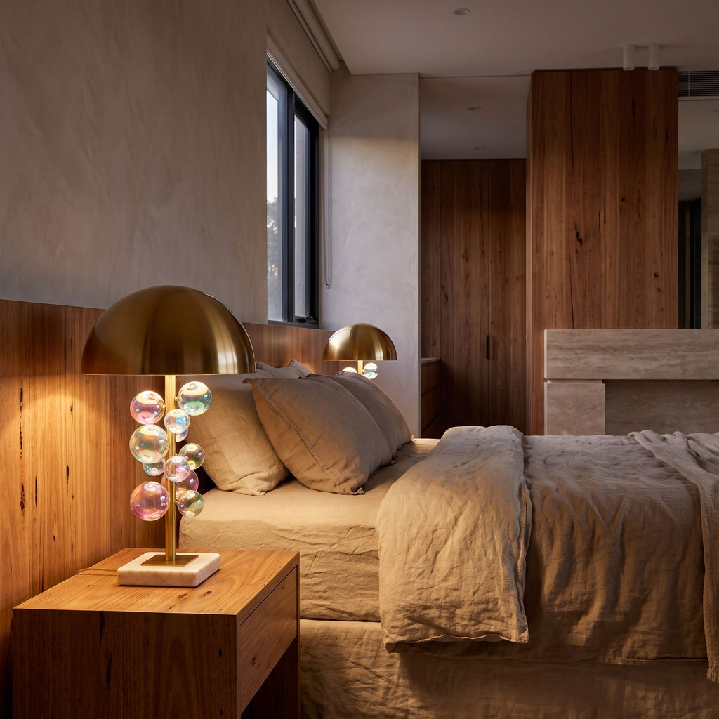 Glass Orb Cluster Marble Table Lamp on a bedside table