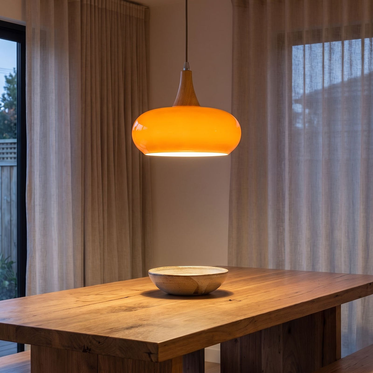 Glass Saucer Shade and Timber Pendant Light in a styled Australian interior with the light on