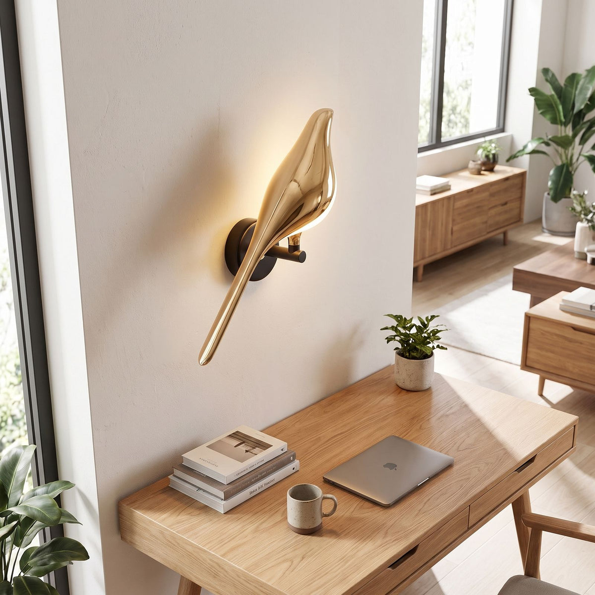 Gold bird sculpture LED wall light above a home office desk in daylight