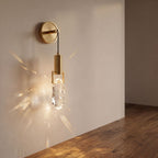 Gold hook hanging glass rock wall light on a hallway wall