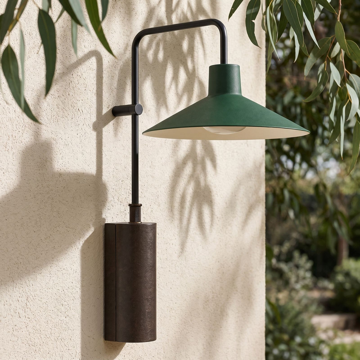 Green Cone Shade Outdoor Wall Light on a rendered wall, angled close view