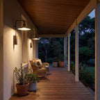 Green Cone Shade Outdoor Wall Lights along a covered verandah in the evening