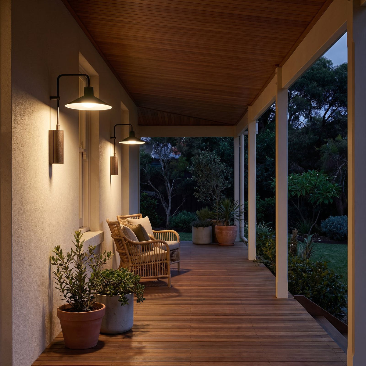 Green Cone Shade Outdoor Wall Lights along a covered verandah in the evening