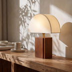 Half Moon Shade Bamboo Base Table Lamp, close view on a timber surface