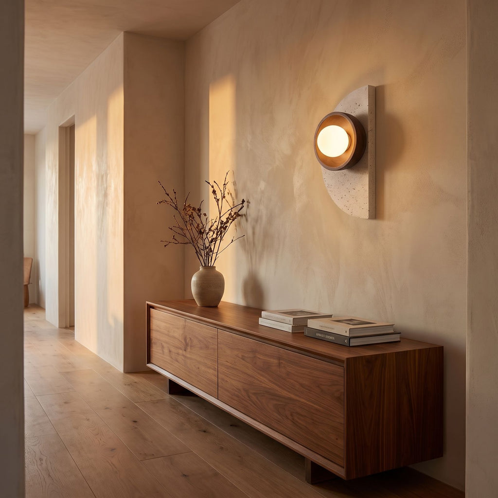 Half Moon Travertine and Wood Wall Light in a hallway above a timber console