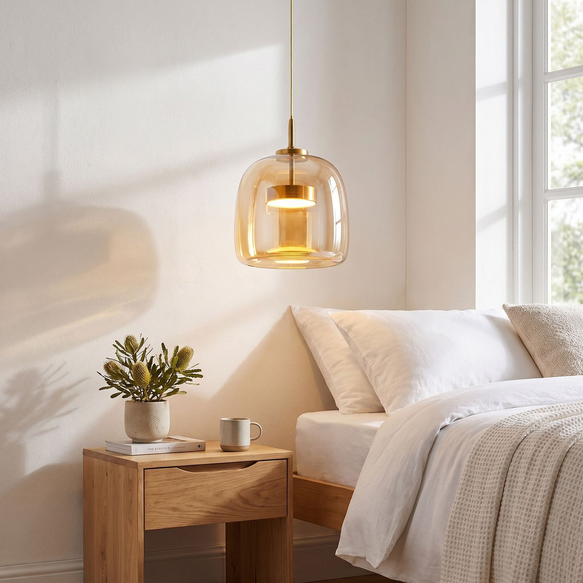 Hand Blown Glass LED Pendant Light beside a bed as a bedside pendant