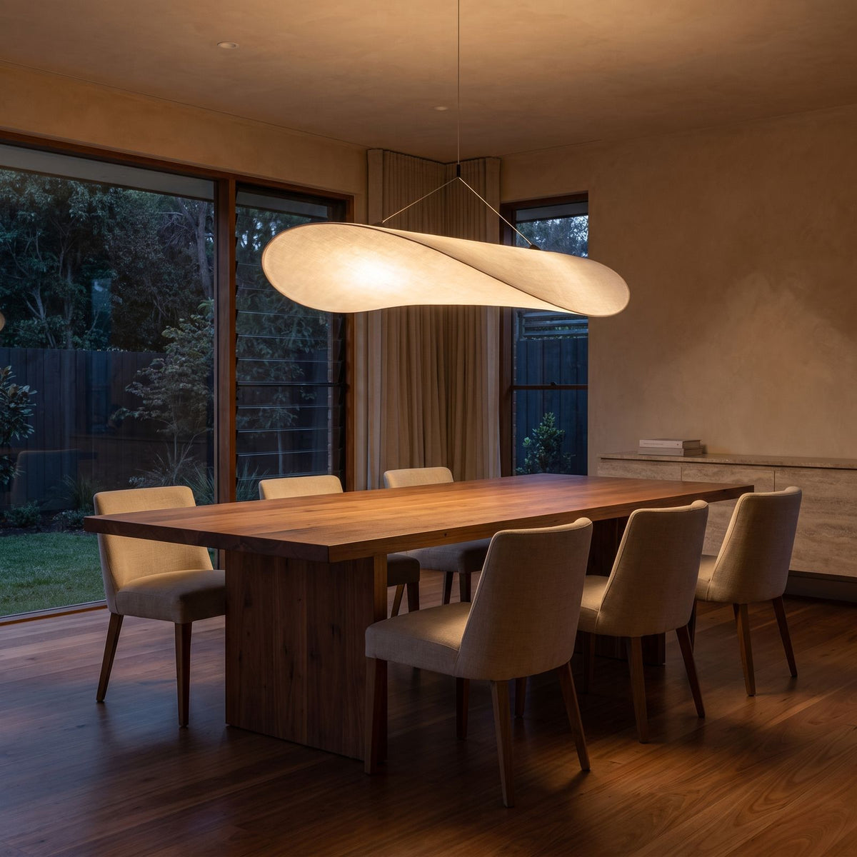 Hand-Knitted Silk Fabric Pendant Light above a timber dining table