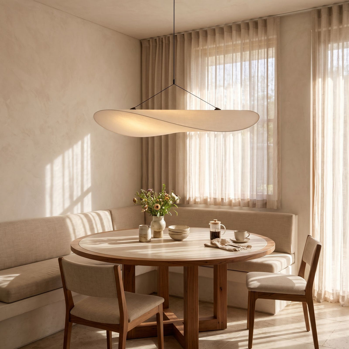 Hand-Knitted Silk Fabric Pendant Light above a round table in a breakfast nook