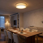 Hand-Woven Acrylic Drum Shade Ceiling Light above a dining area