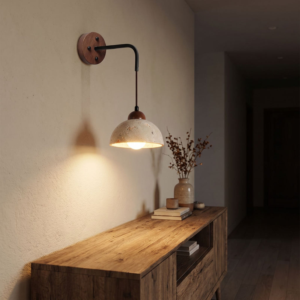 Hanging Travertine Shade LED Wall Light in a hallway above a timber console