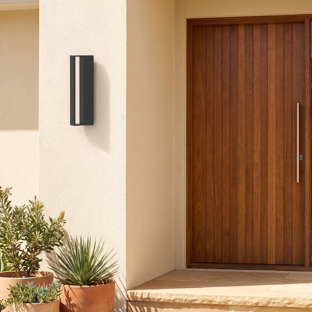 Hollow Rectangle Acrylic Outdoor Wall Light beside a timber front door