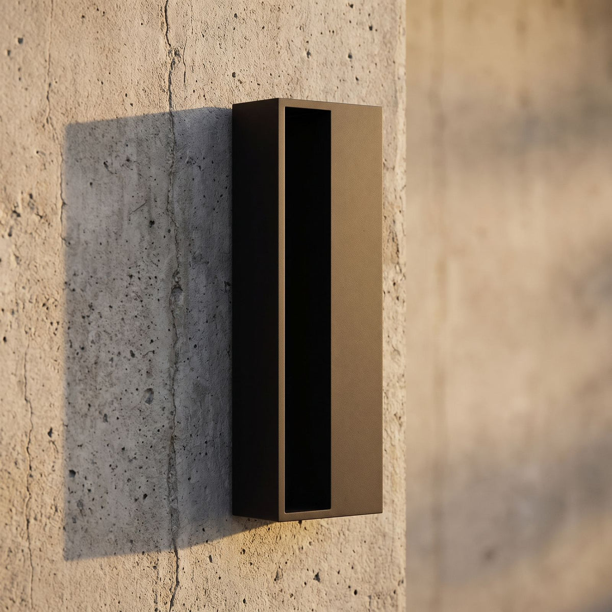 Hollow Rectangle Acrylic Outdoor Wall Light, close view at 45 degrees on a stone wall
