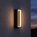 Hollow Rectangle Acrylic Outdoor Wall Light on a porch wall at dusk