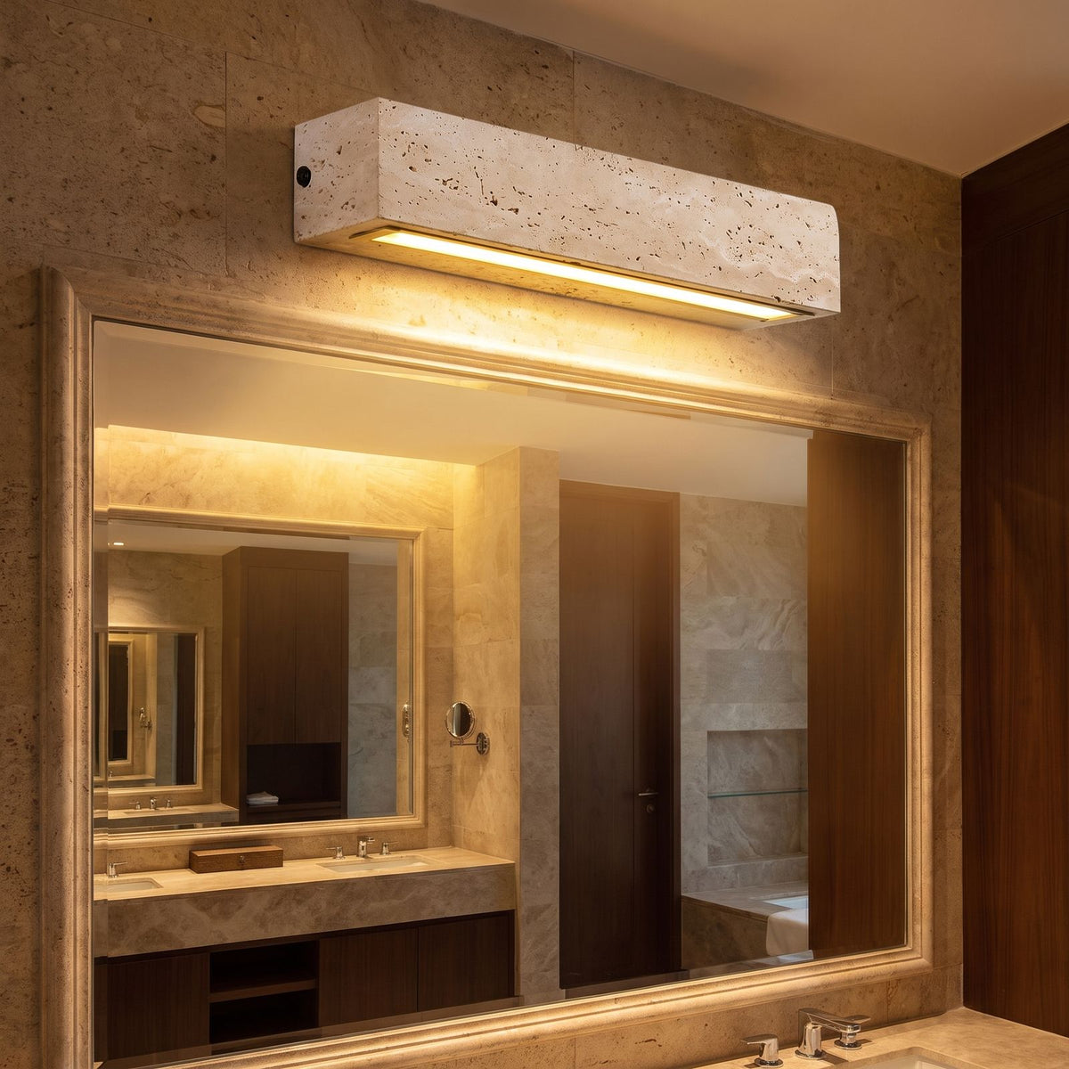 Horizontal Yellow Travertine Bar Wall Light in a hallway above a timber console