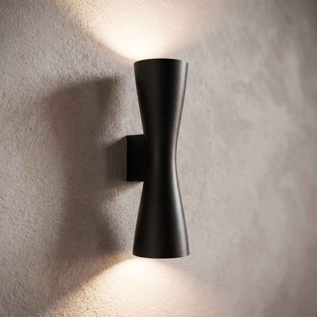 Hourglass Aluminium Up Down Wall Light, close view at 45 degrees on a plaster wall