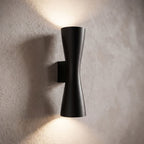 Hourglass Aluminium Up Down Wall Light, close view at 45 degrees on a plaster wall