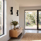 Hourglass Aluminium Up Down Wall Light in a pair on a wall of an Australian home