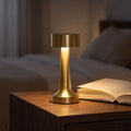 Hourglass Metal Rechargeable Table Lamp in a styled Australian interior with the light on