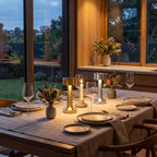 Gold and silver cordless Hourglass table lamps on a set dinner table