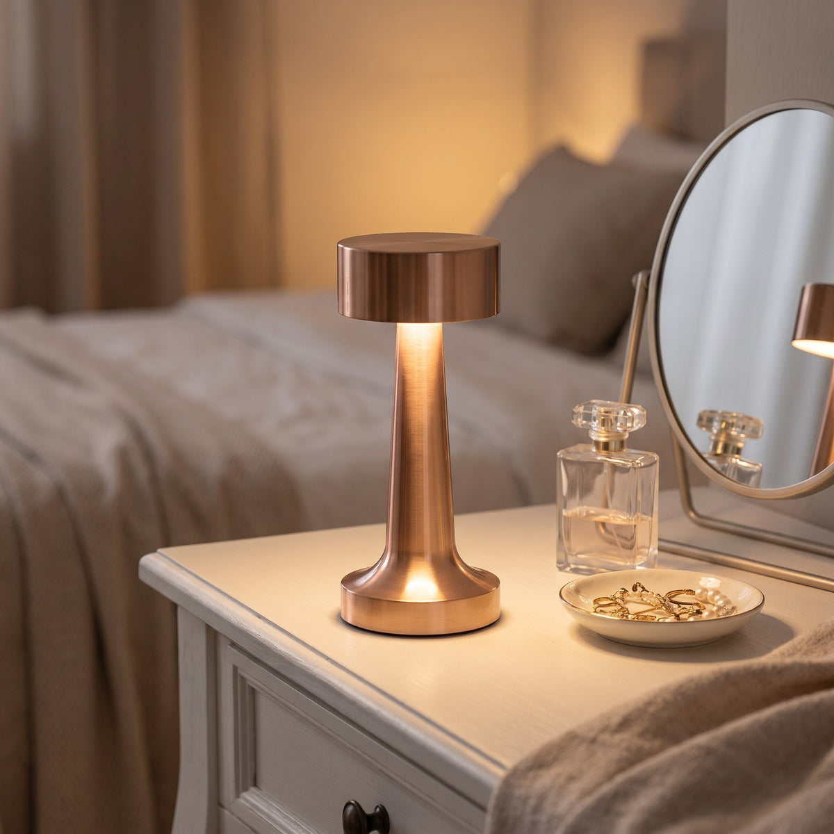 Rose gold Hourglass cordless table lamp on a dressing table