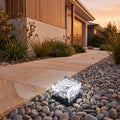 Ice Cube Tempered Glass Solar Path Light beside a front garden path at golden hour