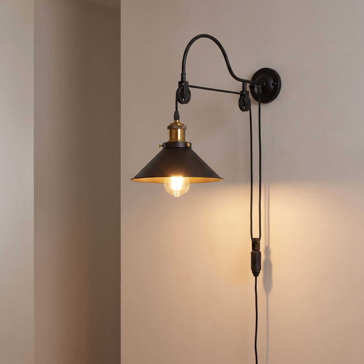 Industrial pulley wall light on a hallway wall