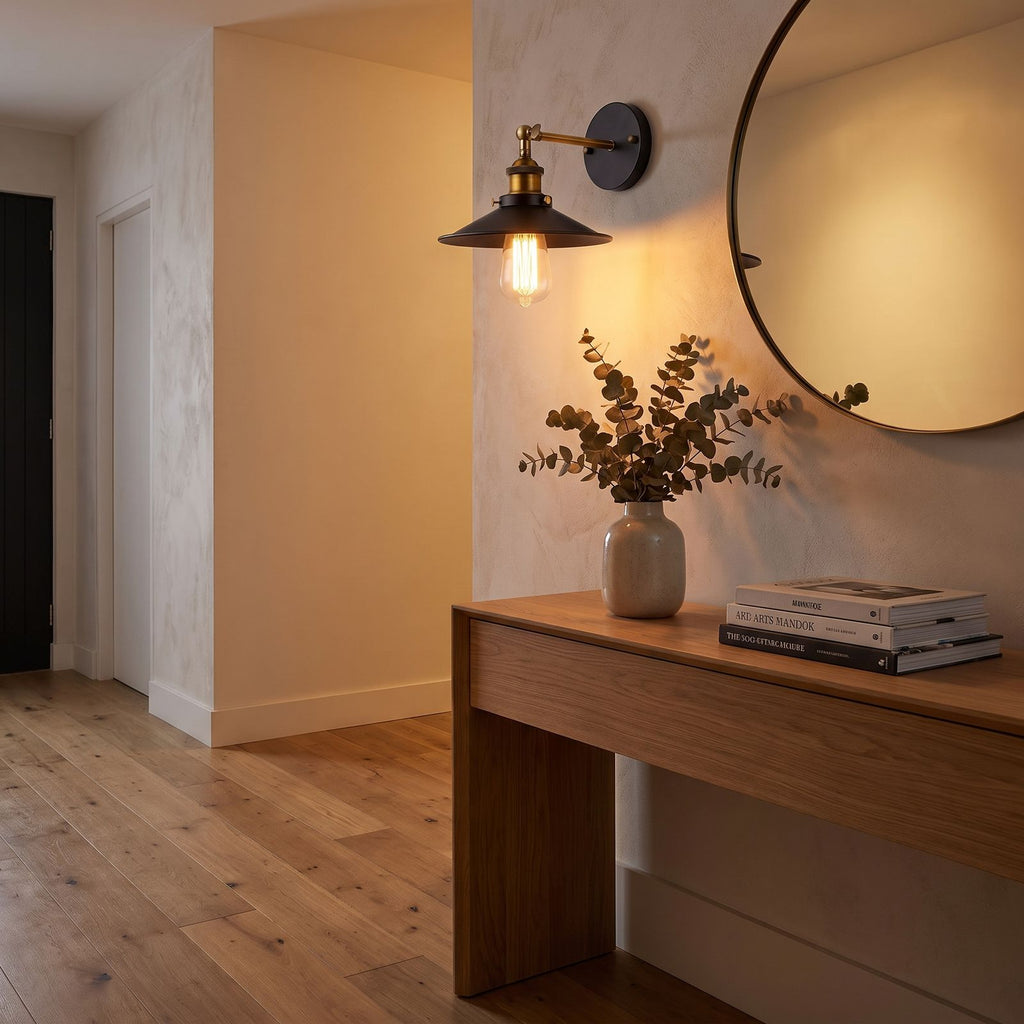 Industrial Saucer Shade Iron Wall Light in a hallway above a timber console