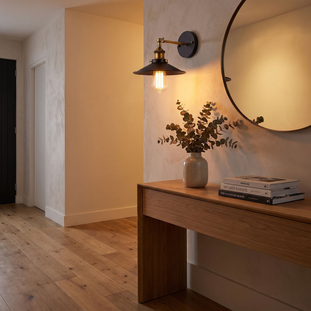 Industrial Saucer Shade Iron Wall Light in a hallway above a timber console