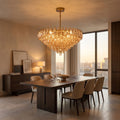 Inverted Dome Faceted Glass Prism Chandelier above a dining table at golden hour