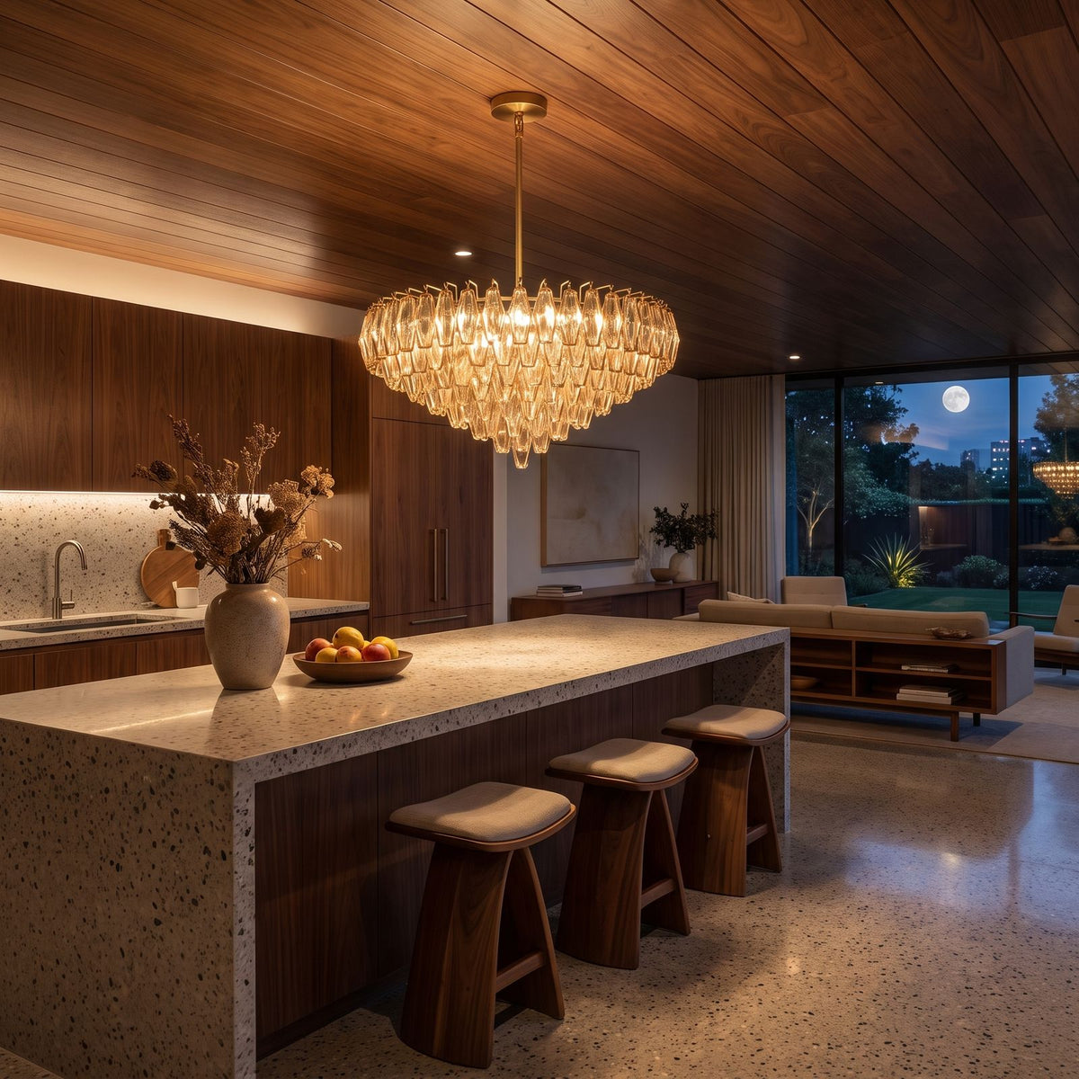 Inverted Dome Faceted Glass Prism Chandelier above a kitchen island at night