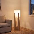 Japandi Wood Frame Fabric Shade Floor Lamp beside an armchair in a living room corner
