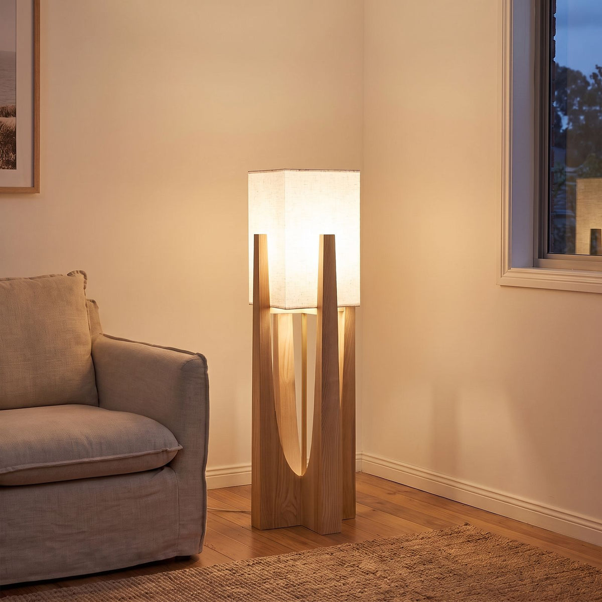 Japandi Wood Frame Fabric Shade Floor Lamp beside an armchair in a living room corner