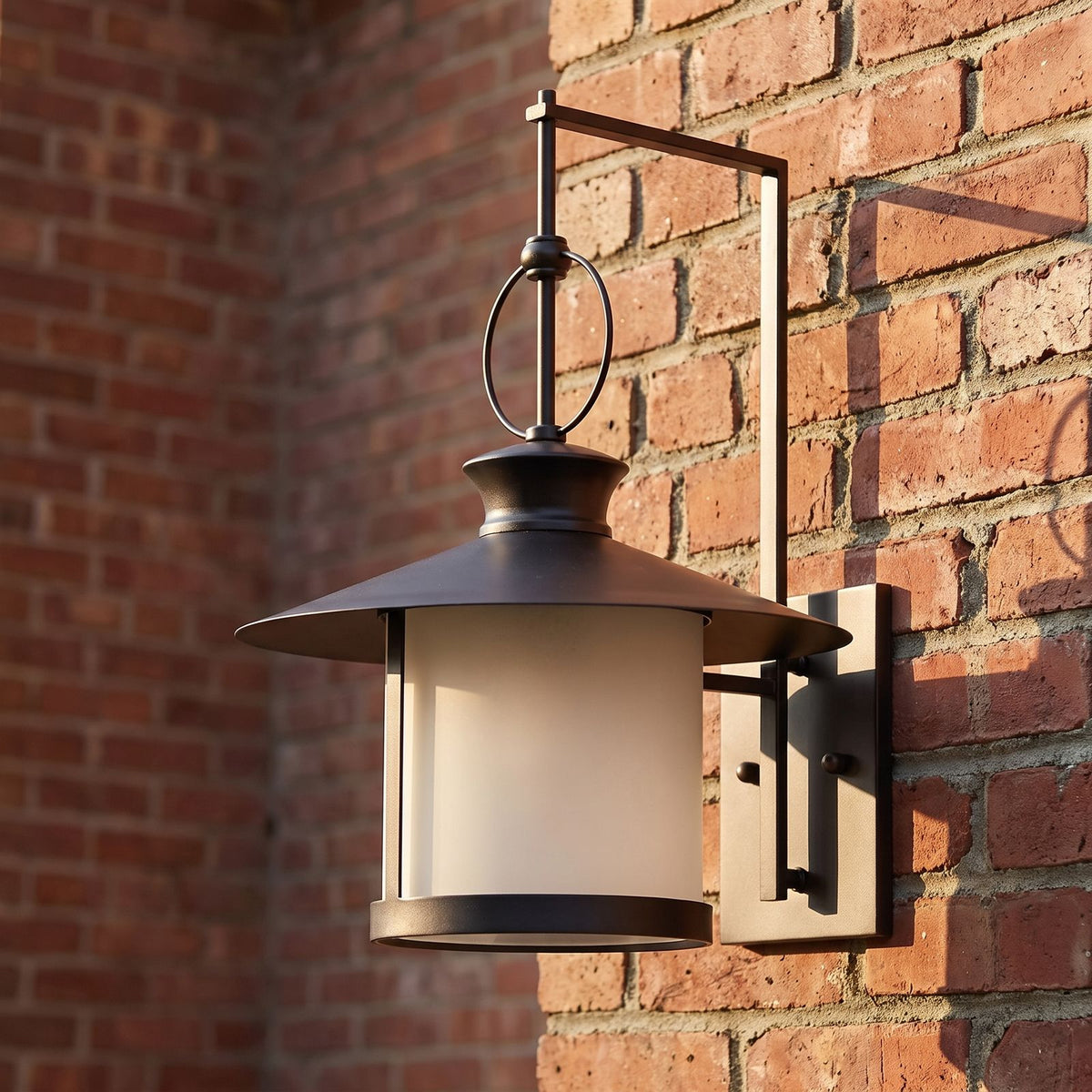 Large Black Iron Lantern Outdoor Wall Light, close view at 45 degrees on a stone wall