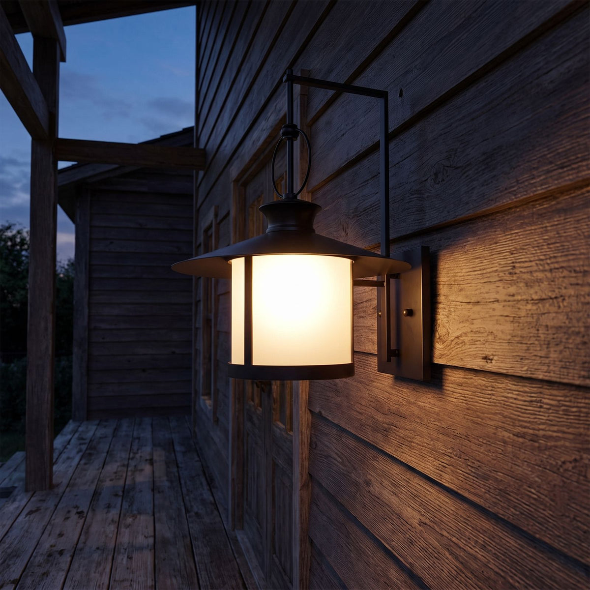 Large Black Iron Lantern Outdoor Wall Light on a porch wall at dusk