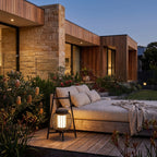 Large Retro Stainless Steel Outdoor Table Lamp on a timber deck beside a daybed