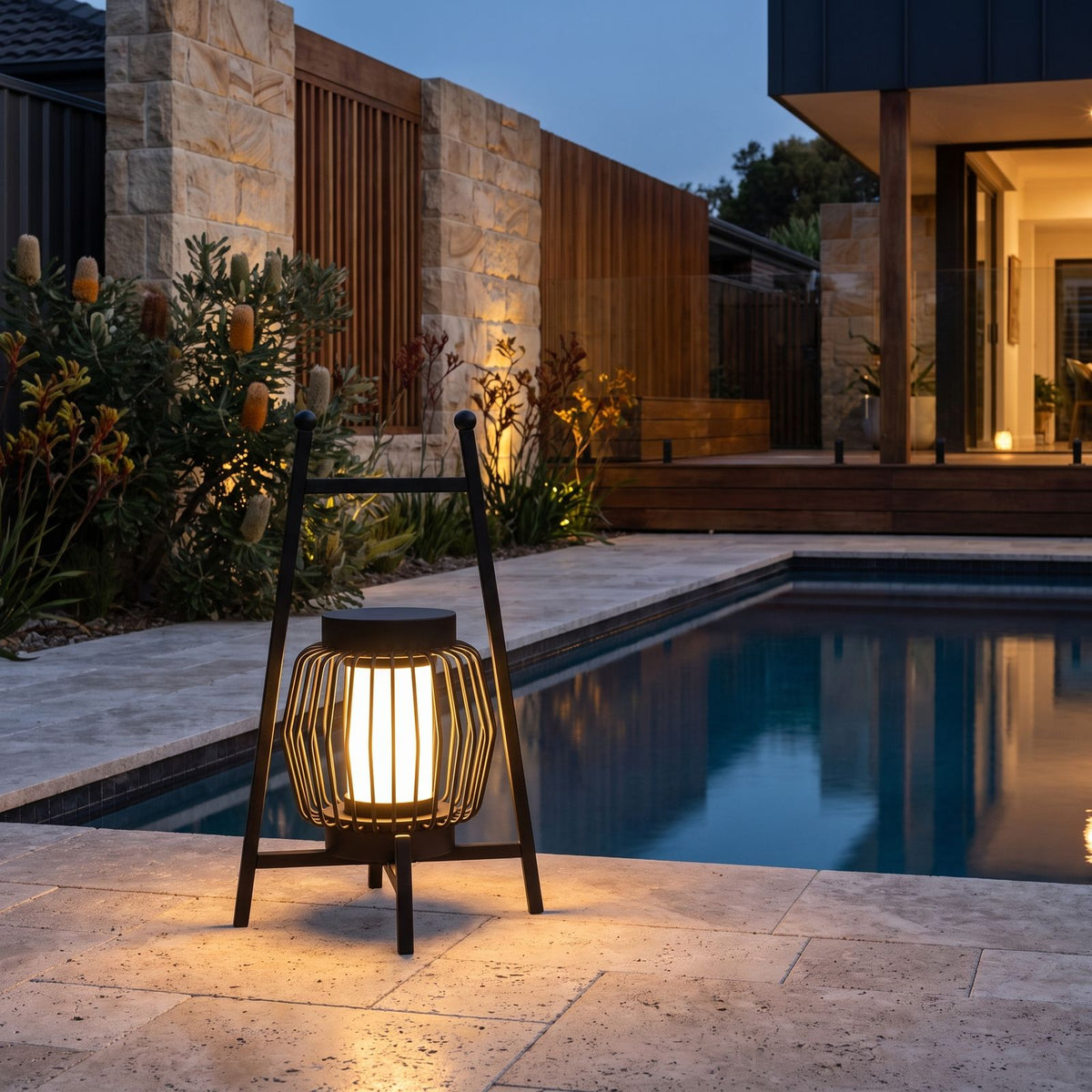 Large Retro Stainless Steel Outdoor Table Lamp beside a pool at dusk