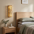 Layered Crystal Ribbon LED Wall Light on a bedroom wall beside the bed