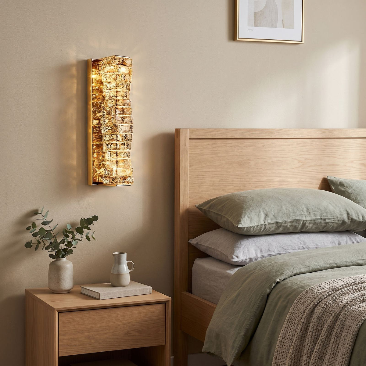 Layered Crystal Ribbon LED Wall Light on a bedroom wall beside the bed