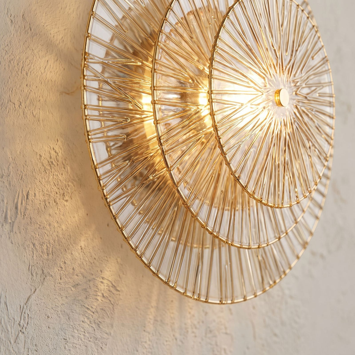 Layered Lotus Glass Round LED Wall Light, close view at 45 degrees on a plaster wall