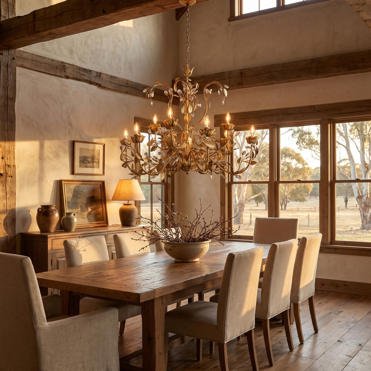 Leaf Branch Iron and Crystal Chandelier above a dining table at golden hour