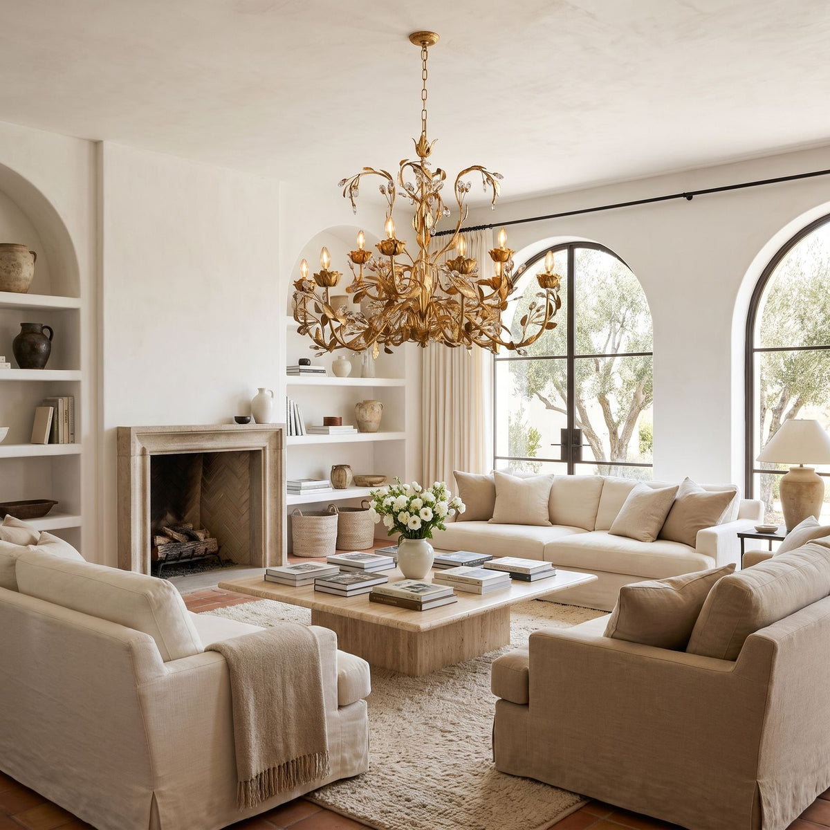 Leaf Branch Iron and Crystal Chandelier above a coffee table in a living room in daylight