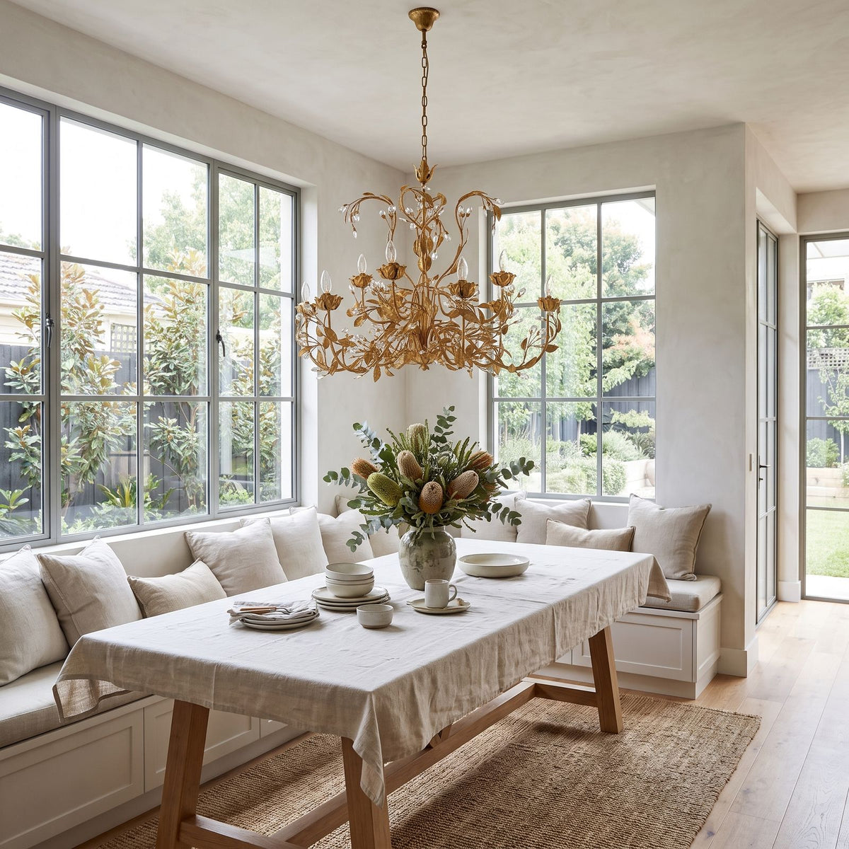 Leaf Branch Iron and Crystal Chandelier in a styled bedroom in soft daylight