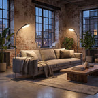 Pair of gooseneck floor lamps at each end of a sofa in a loft living room in the evening