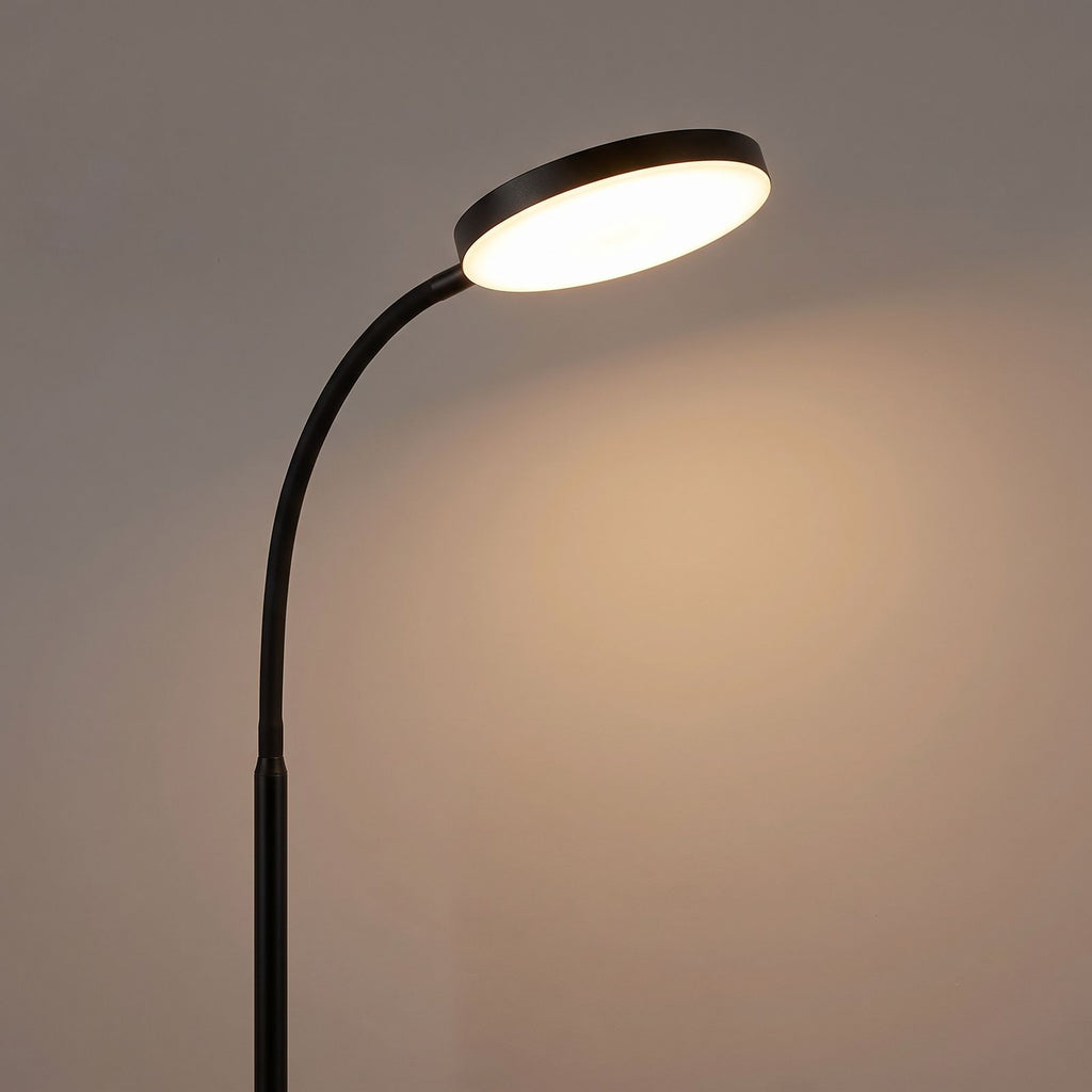 Close view of the round LED head and flexible gooseneck, switched on