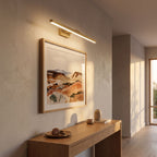 Linear Brushed Brass LED Vanity Wall Light lighting a second setting in an Australian home